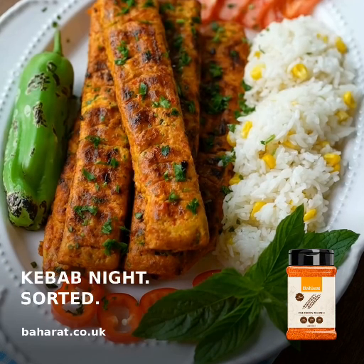 Golden chicken mince kebabs served with rice, tomatoes and a grilled green pepper